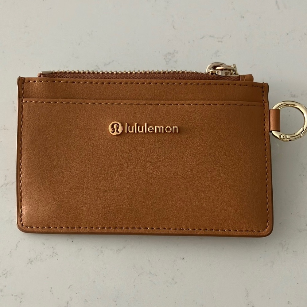 Lululemon leather alternative card case in chestnut brown and gold